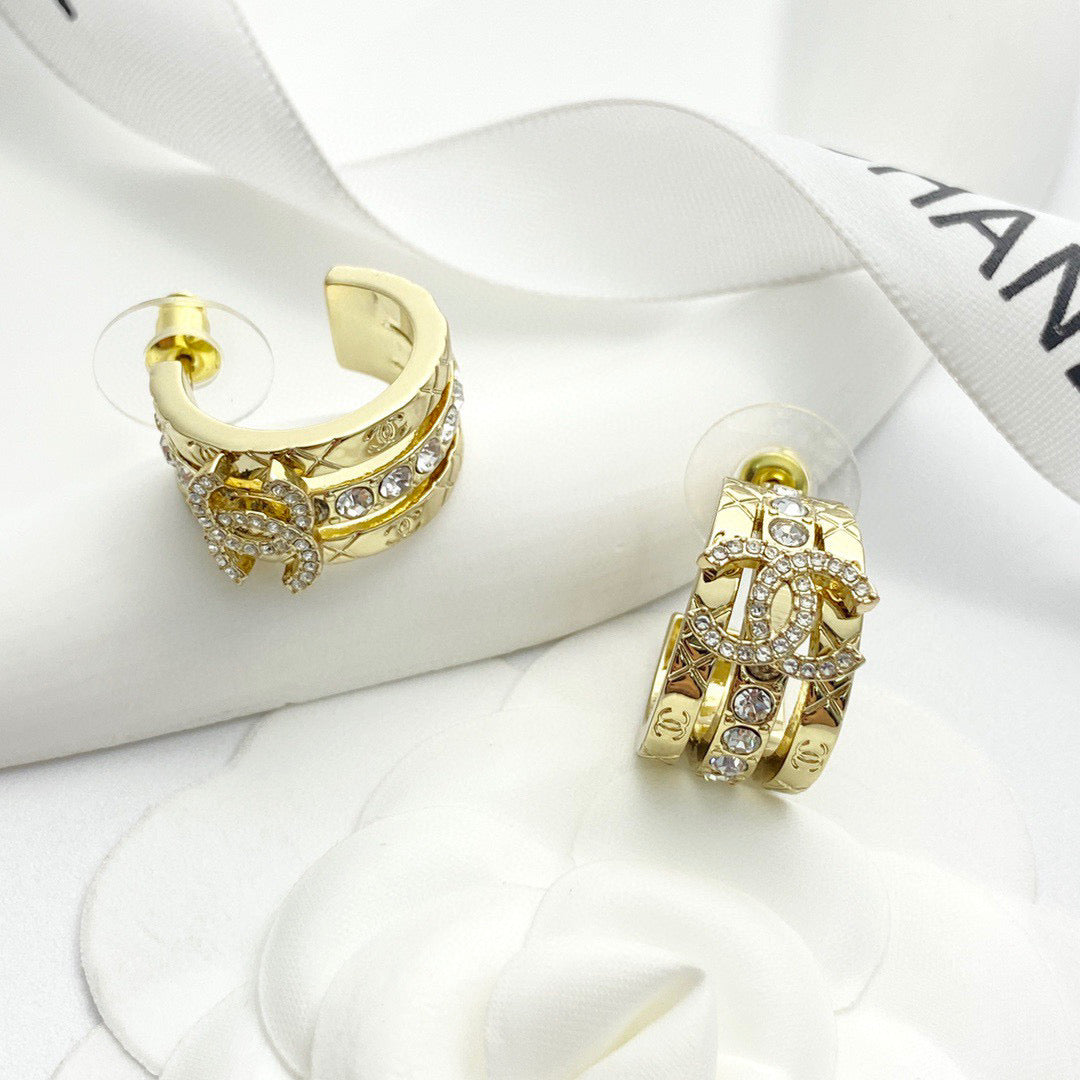 Martin Graham stud earrings in polished metal-tone – styled product view