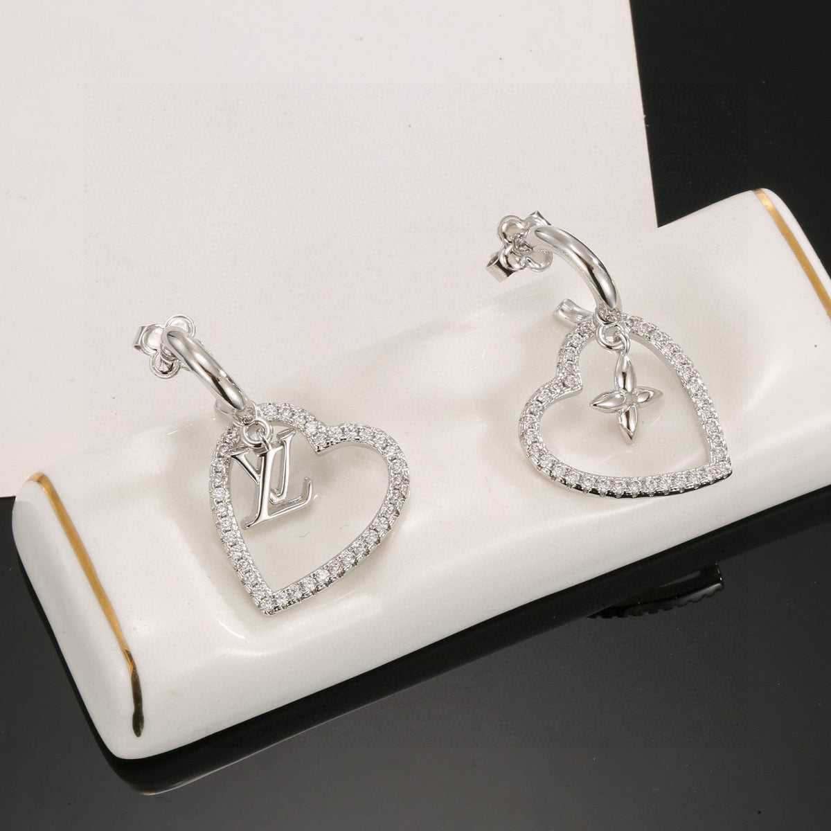 Martin Graham stud earrings in polished metal-tone – front product view