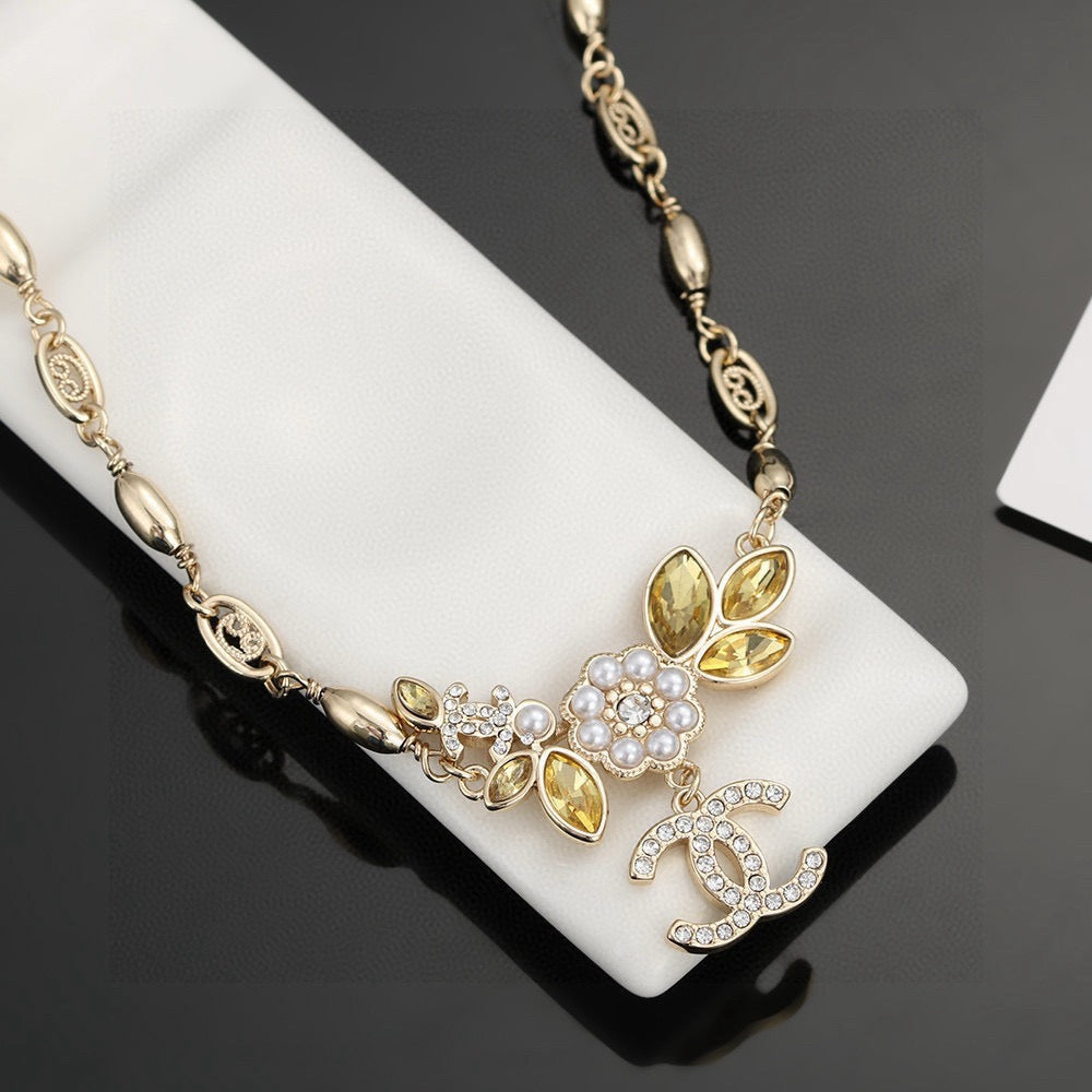 Martin Graham pendant necklace in polished metal-tone – detail view