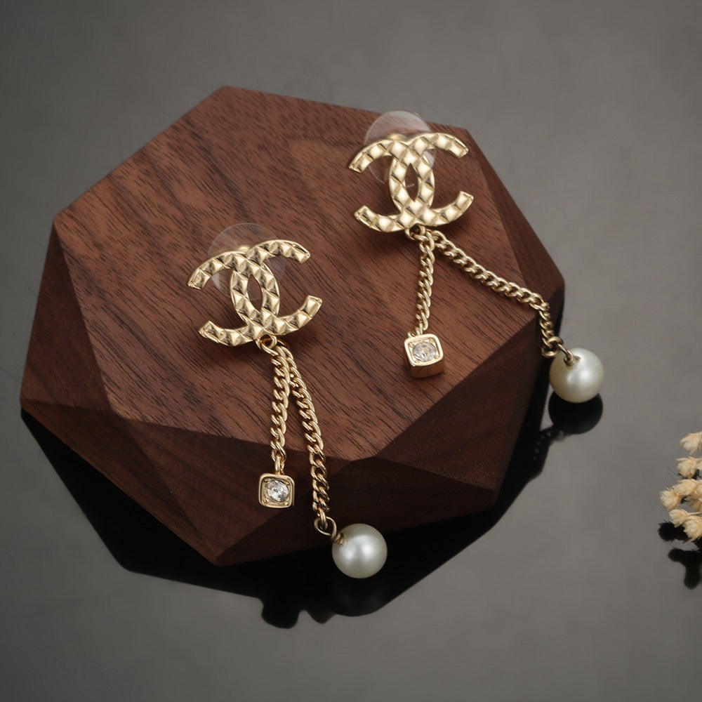 Martin Graham stud earrings in polished metal-tone – styled product view