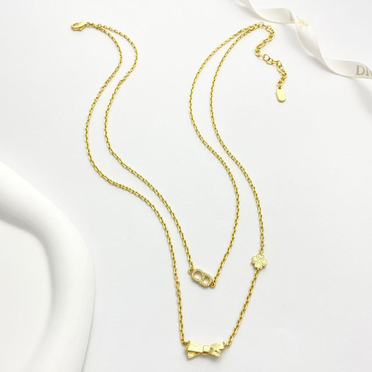 Martin Graham pendant necklace in polished metal-tone – front view