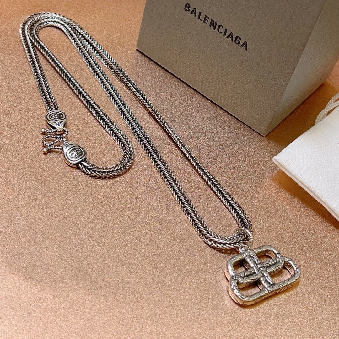 Martin Graham pendant necklace in polished metal-tone – detail view