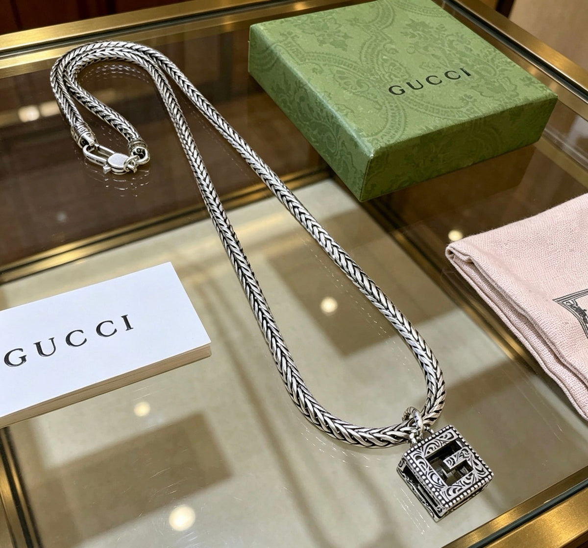 Martin Graham pendant necklace in polished metal-tone – detail view