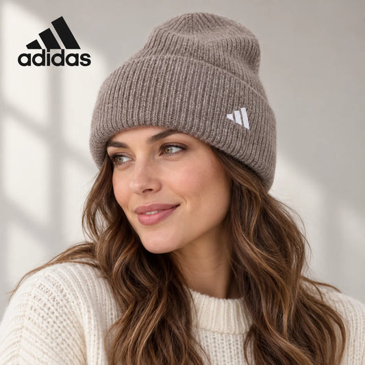 Adidas ribbed knit beanie worn by an adult female model