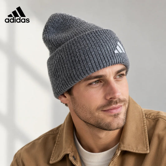 Adidas ribbed knit beanie worn by an adult male model