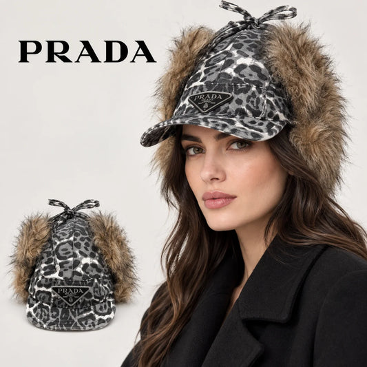 Prada earflap cap worn by an adult female model, with product detail inset.
