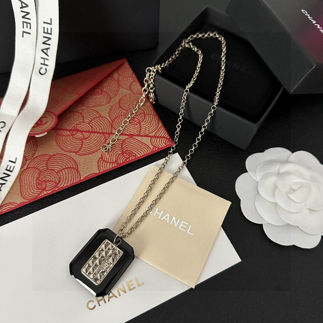 Martin Graham pendant necklace in polished metal-tone – styled product view