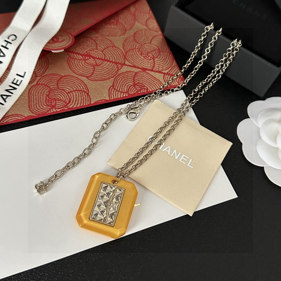Martin Graham pendant necklace in polished metal-tone – detail view