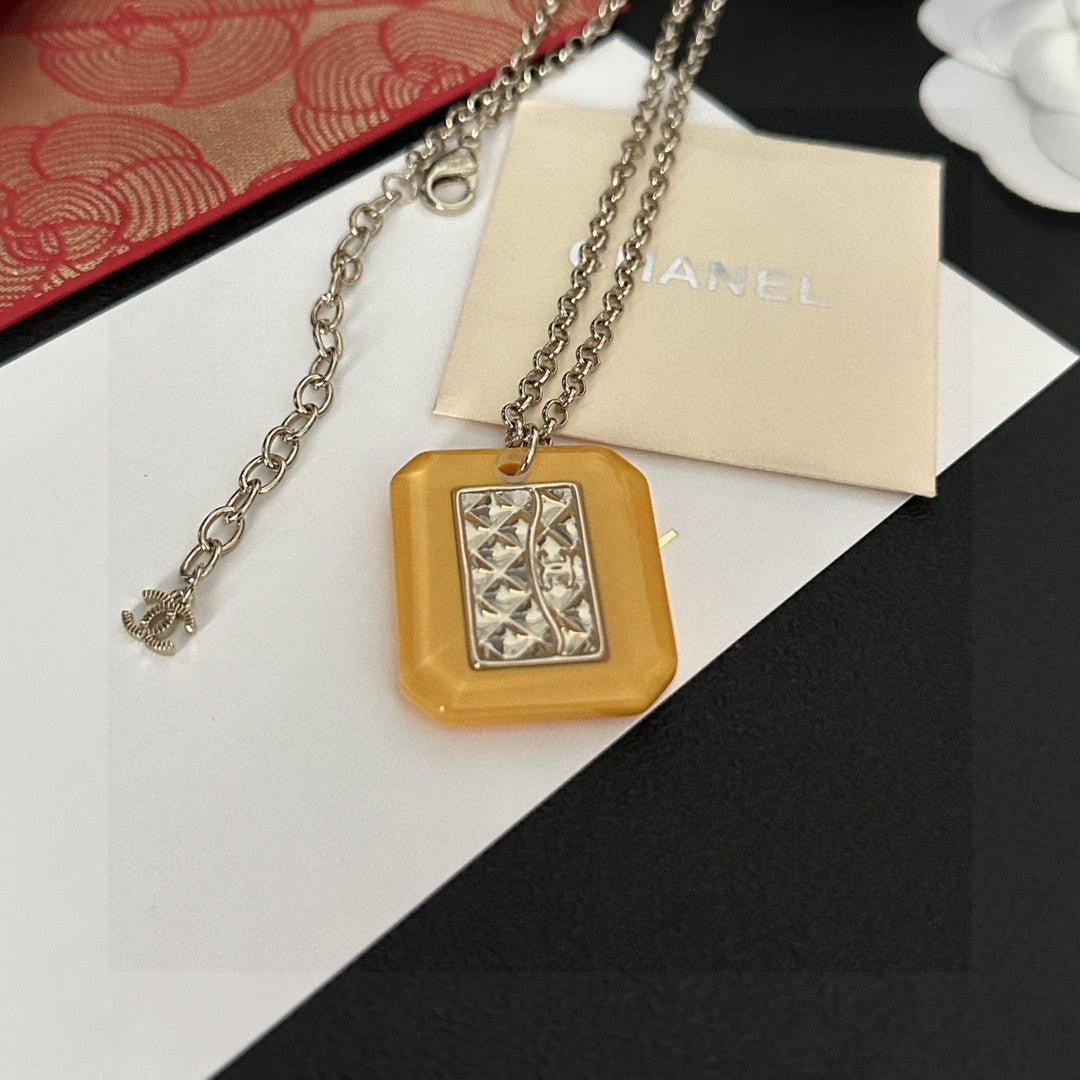 Martin Graham pendant necklace in polished metal-tone – side detail