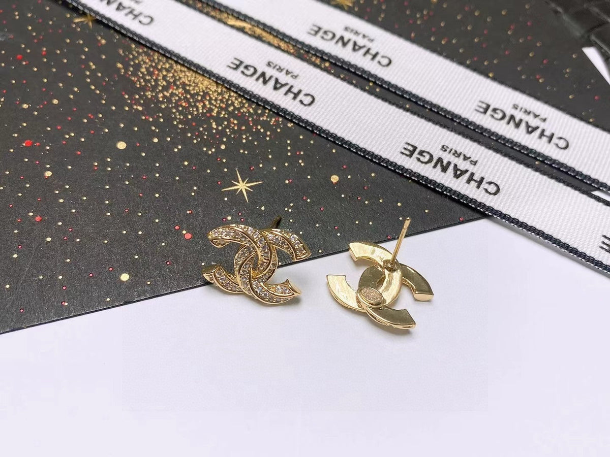 Martin Graham stud earrings in polished metal-tone – side detail
