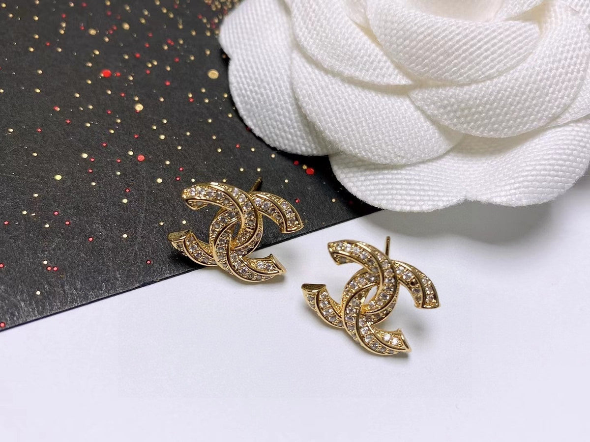 Martin Graham stud earrings in polished metal-tone – detail view