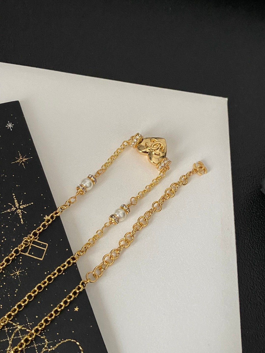 Martin Graham pendant necklace in polished metal-tone – close-up detail