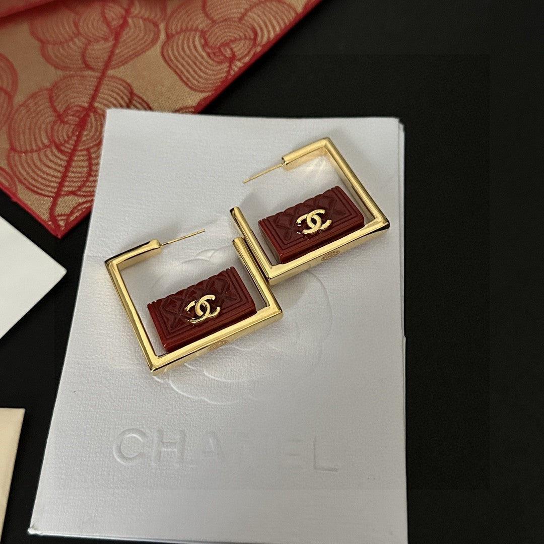 Martin Graham stud earrings in polished metal-tone – styled product view