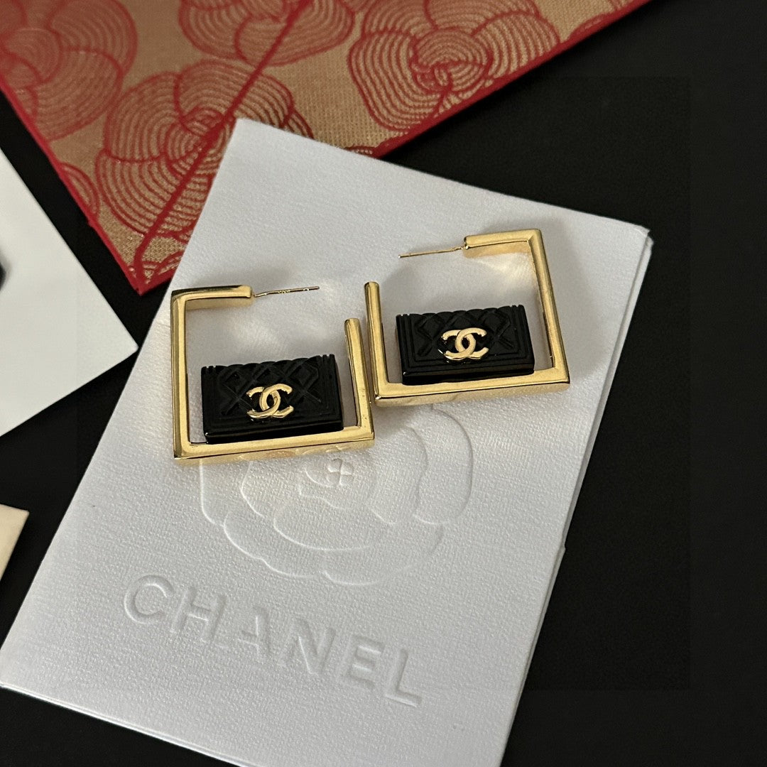 Martin Graham stud earrings in polished metal-tone – side detail