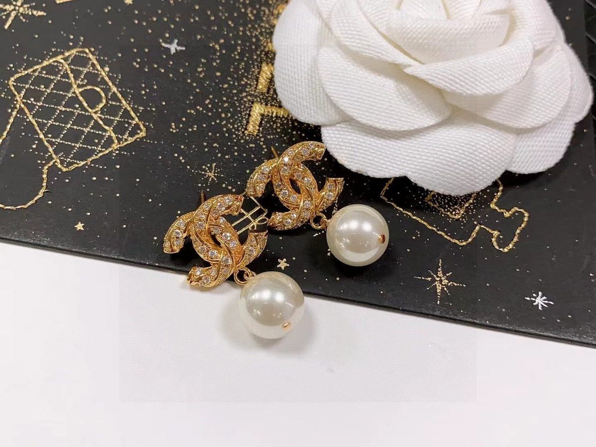 Martin Graham stud earrings in polished metal-tone – front product view