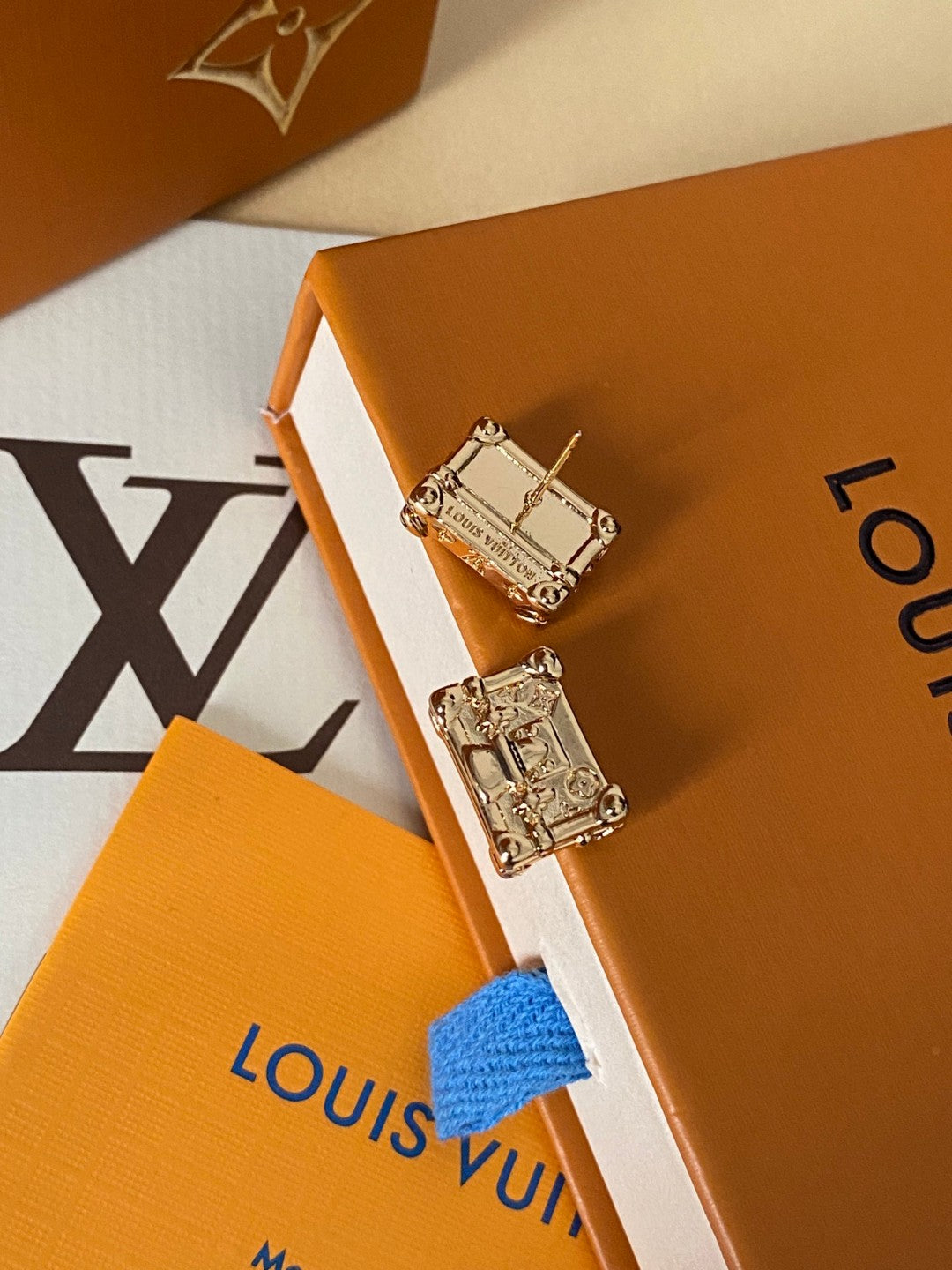 Martin Graham stud earrings in polished metal-tone – detail view