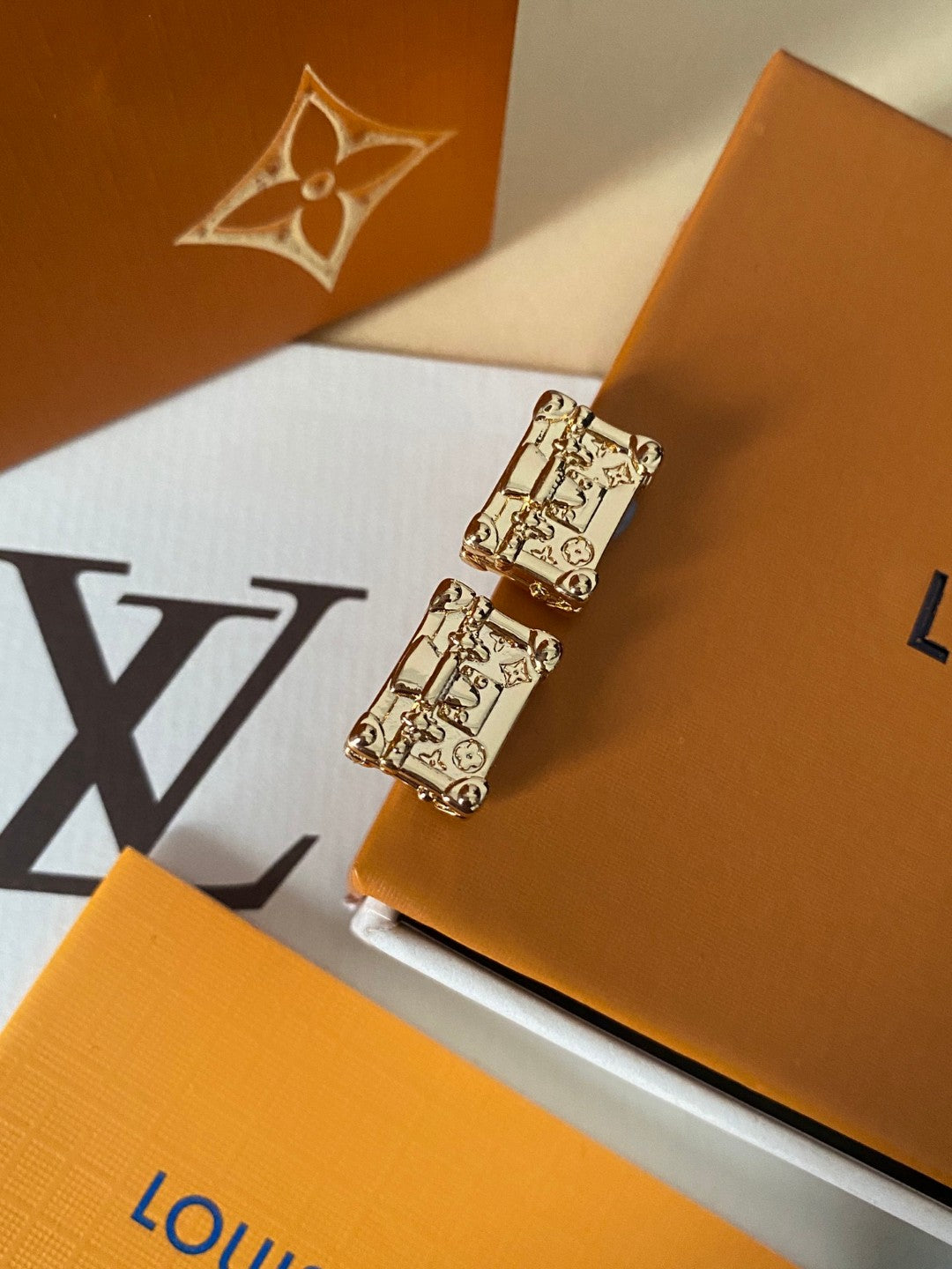 Martin Graham stud earrings in polished metal-tone – front product view