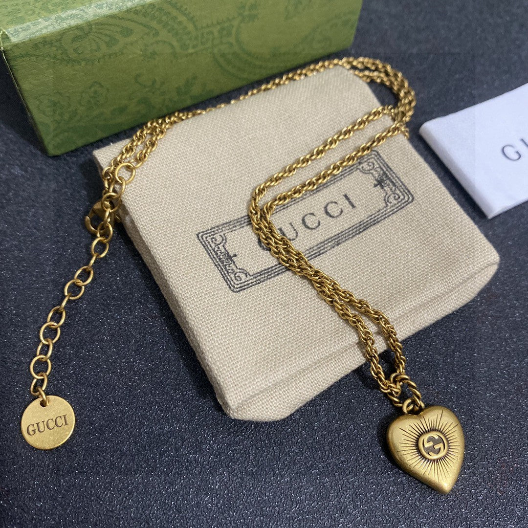 Martin Graham pendant necklace in polished metal-tone – close-up detail