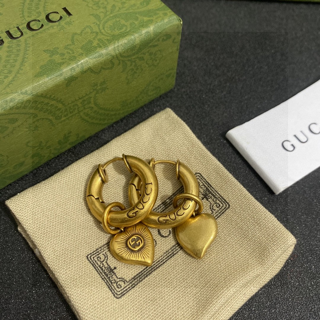 Martin Graham stud earrings in polished metal-tone – front product view