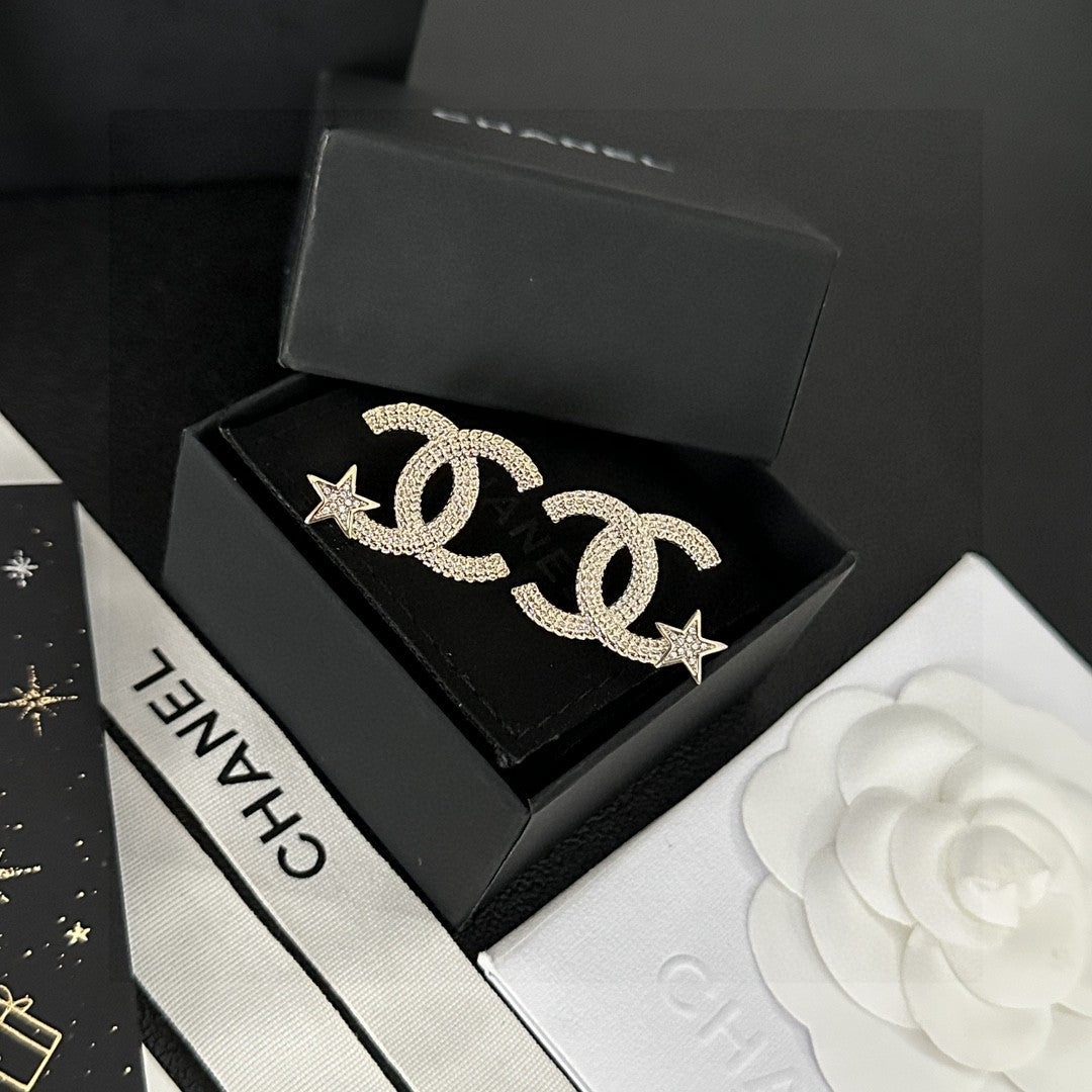 Martin Graham stud earrings in polished metal-tone – detail view