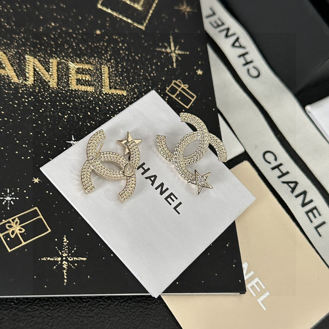 Martin Graham stud earrings in polished metal-tone – close-up detail