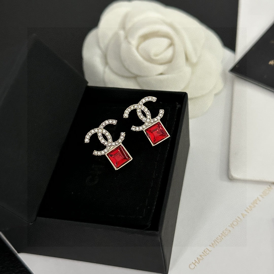 Martin Graham stud earrings in polished metal-tone – detail view