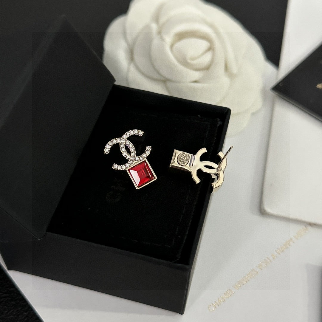 Martin Graham stud earrings in polished metal-tone – close-up detail