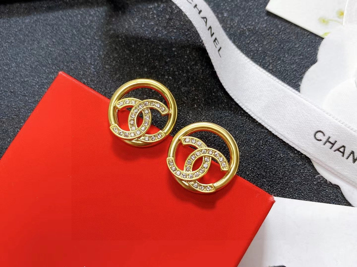 Martin Graham stud earrings in polished metal-tone – front product view
