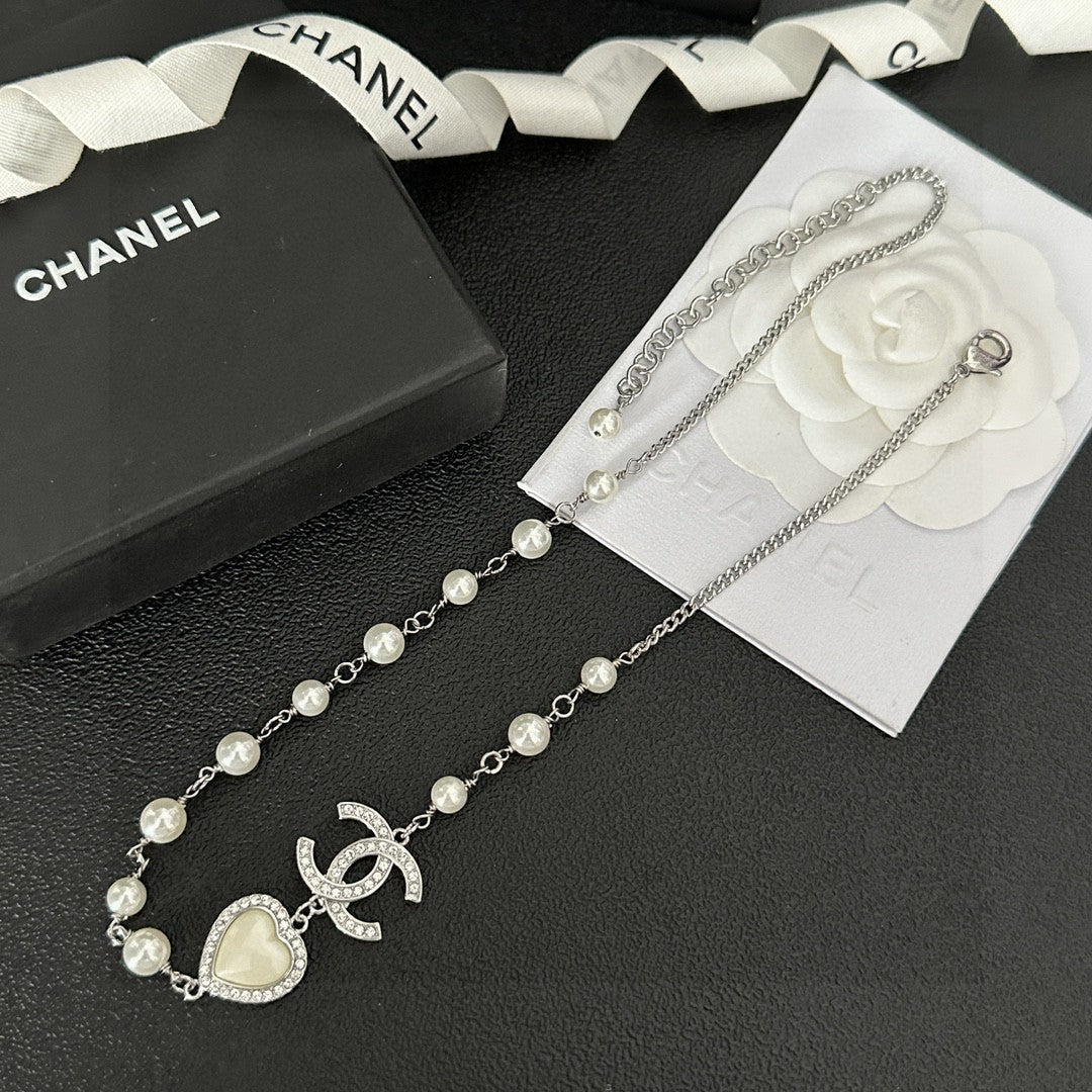 Martin Graham pendant necklace in polished metal-tone – detail view