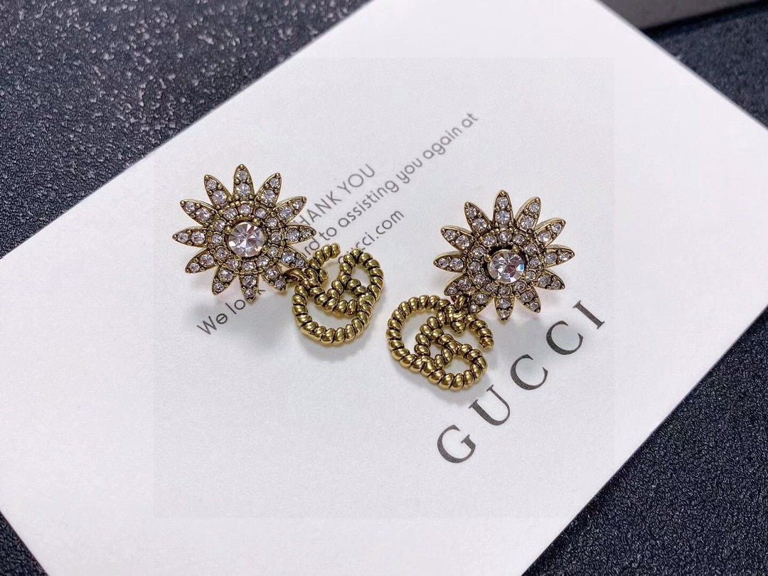 Martin Graham stud earrings in polished metal-tone – front product view