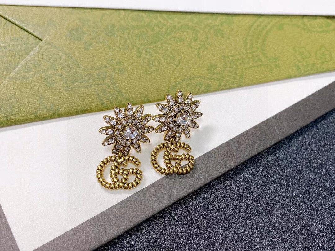 Martin Graham stud earrings in polished metal-tone – side detail