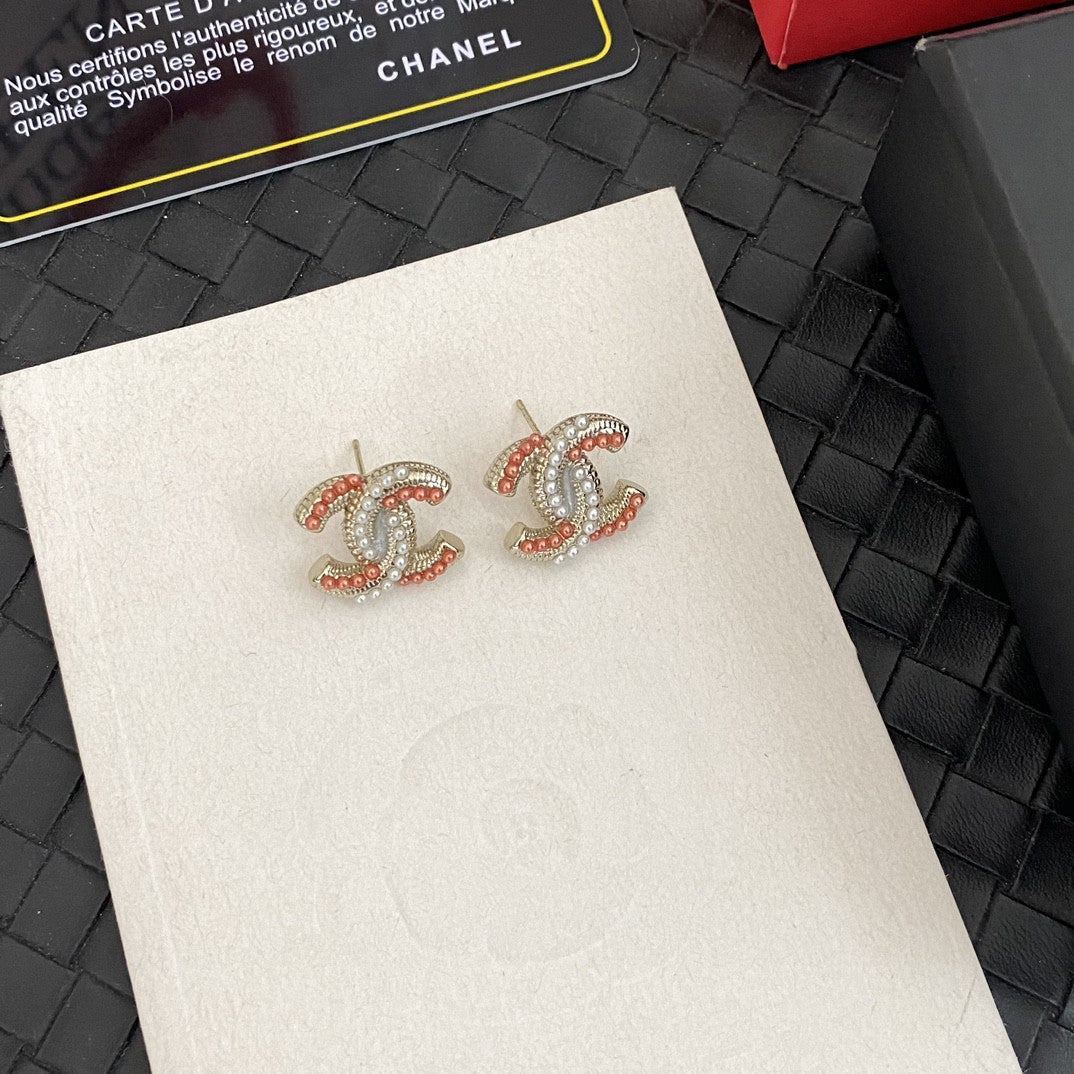 Martin Graham stud earrings in polished metal-tone – styled product view