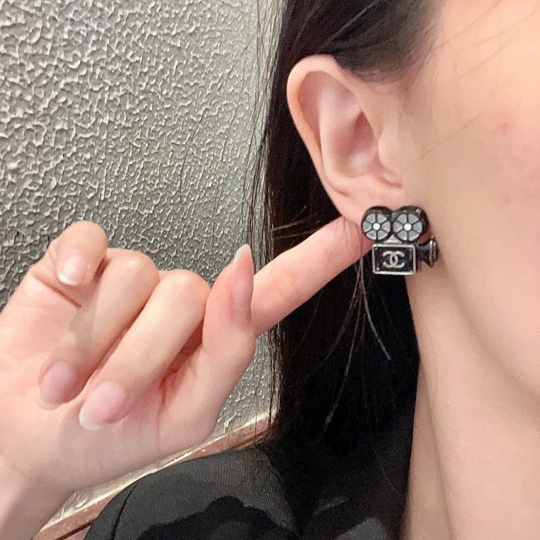 Martin Graham stud earrings in polished metal-tone – front product view