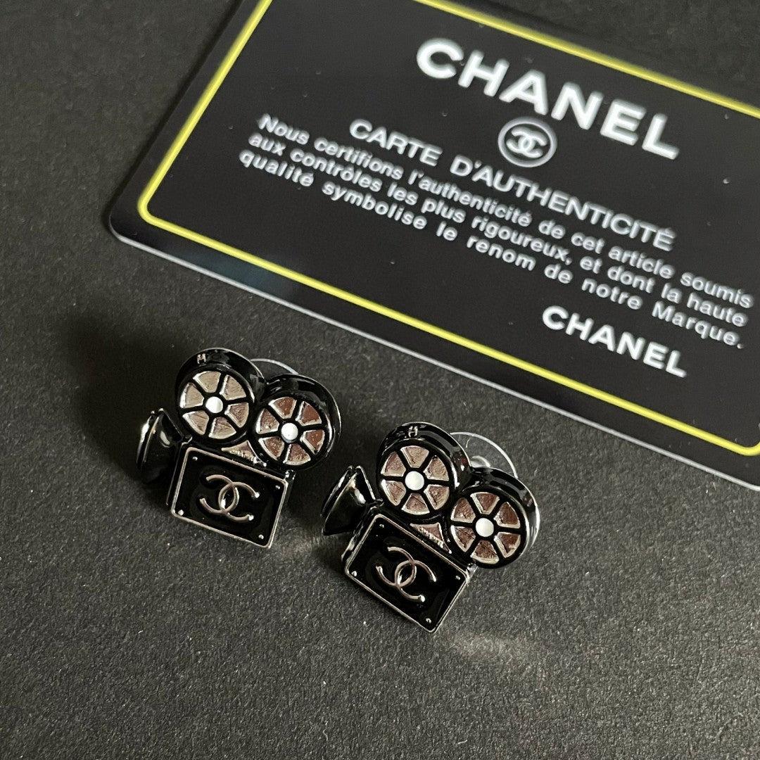 Martin Graham stud earrings in polished metal-tone – styled product view