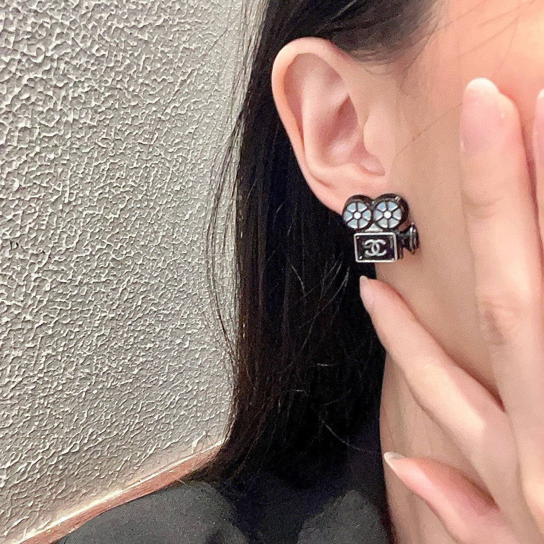 Martin Graham stud earrings in polished metal-tone – detail view