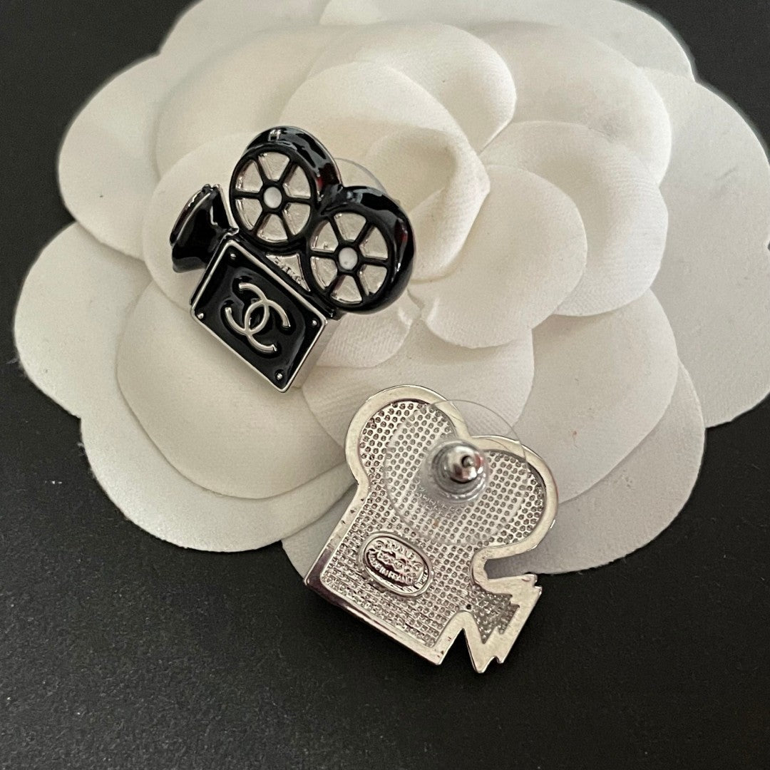 Martin Graham stud earrings in polished metal-tone – front product view