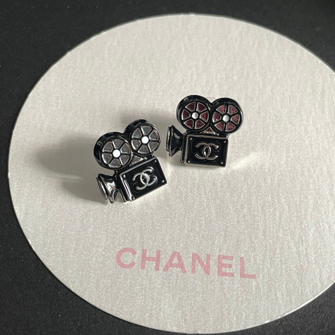 Martin Graham stud earrings in polished metal-tone – detail view
