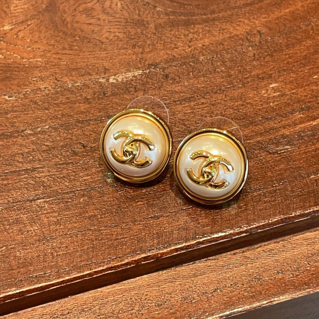 Martin Graham stud earrings in polished metal-tone – styled product view