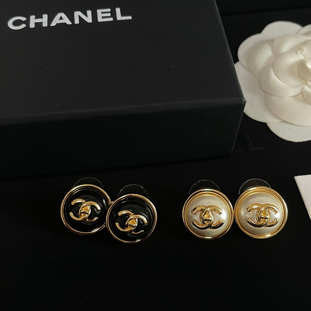 Martin Graham stud earrings in polished metal-tone – detail view