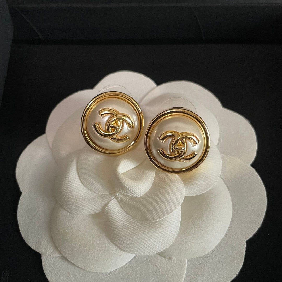 Martin Graham stud earrings in polished metal-tone – front product view