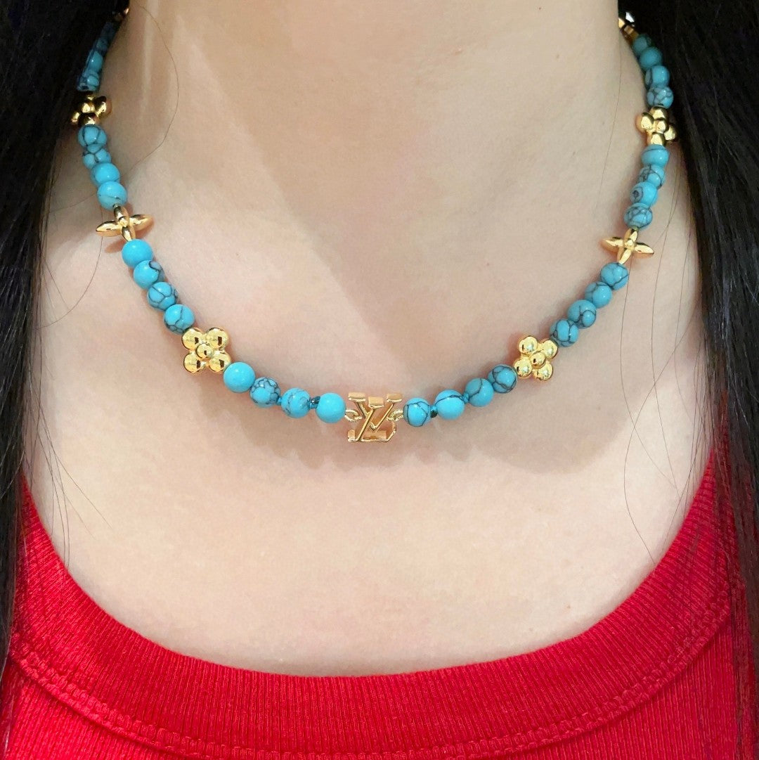 Martin Graham pendant necklace in polished metal-tone – detail view