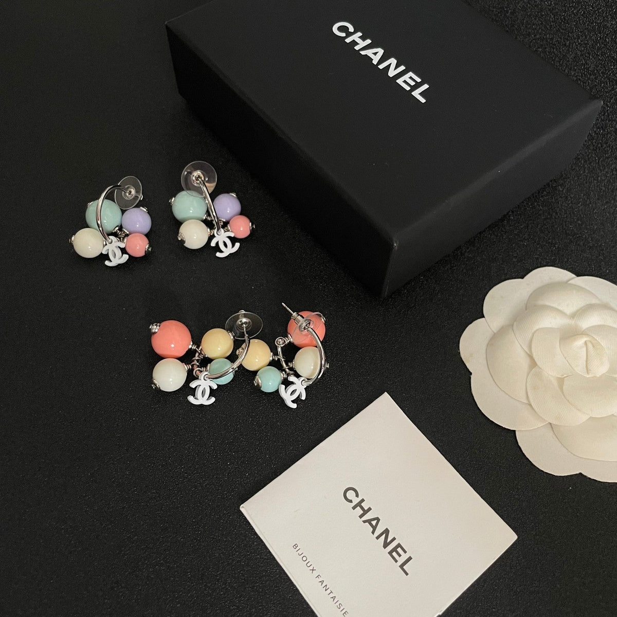 Martin Graham earrings in polished metal-tone – close-up detail
