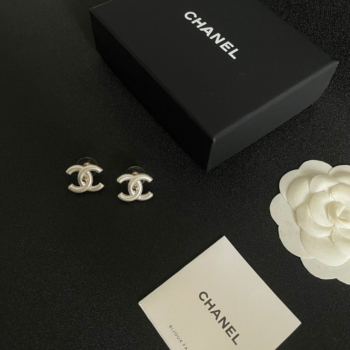 Martin Graham stud earrings in polished metal-tone – styled product view