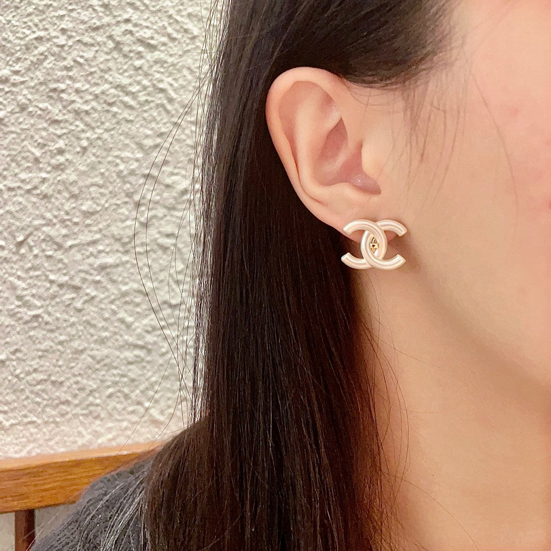 Martin Graham stud earrings in polished metal-tone – side detail