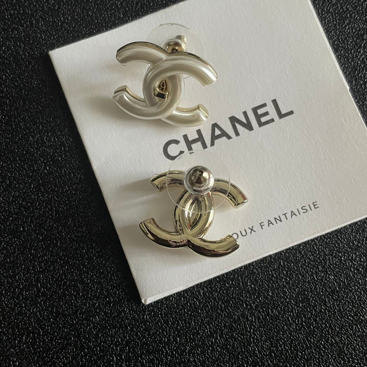 Martin Graham stud earrings in polished metal-tone – front product view