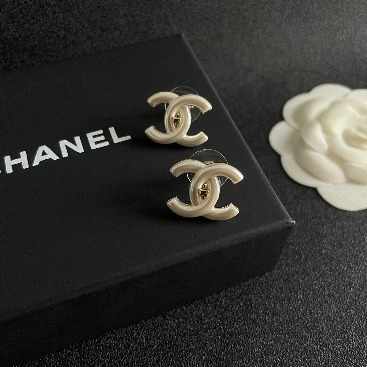 Martin Graham stud earrings in polished metal-tone – side detail