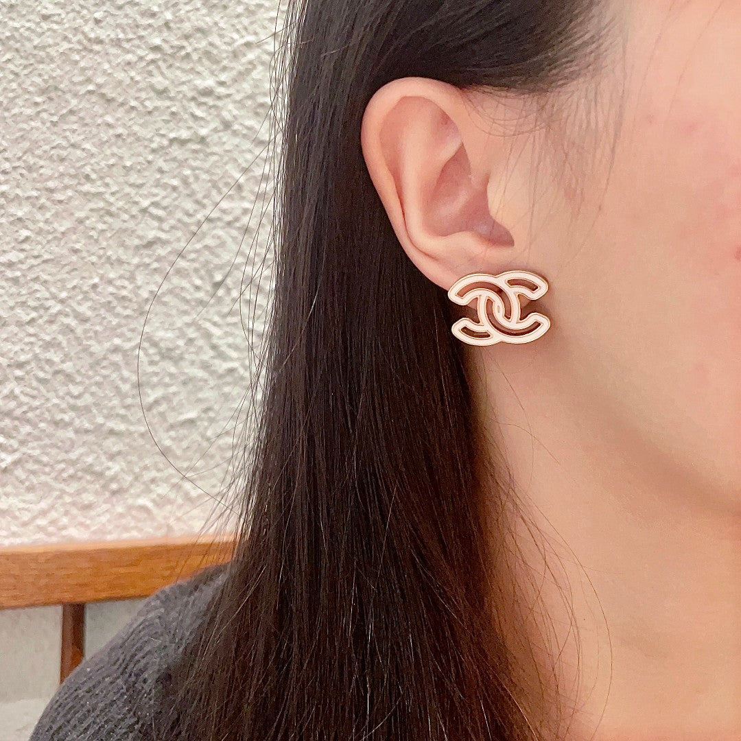 Martin Graham stud earrings in polished metal-tone – detail view