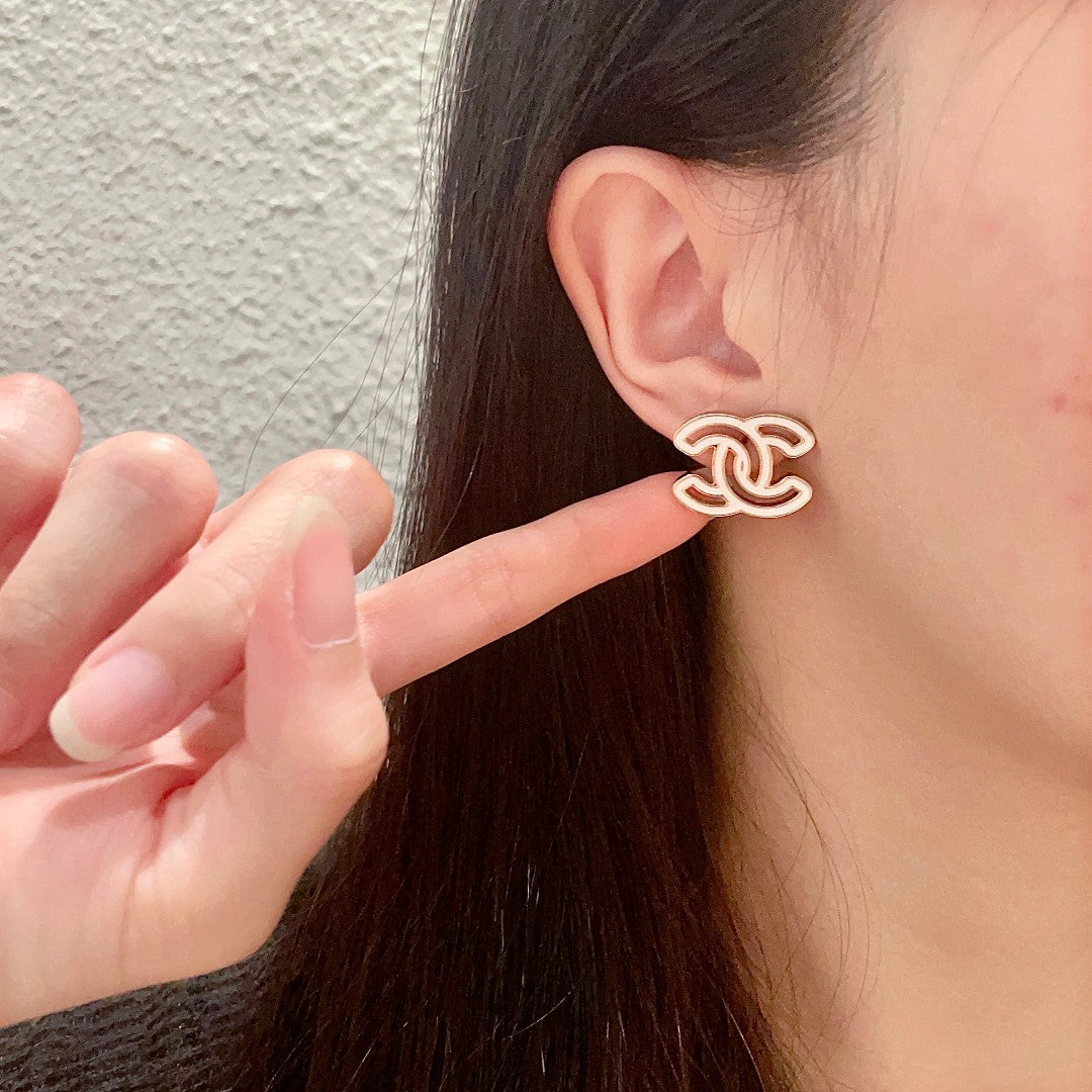 Martin Graham stud earrings in polished metal-tone – front product view