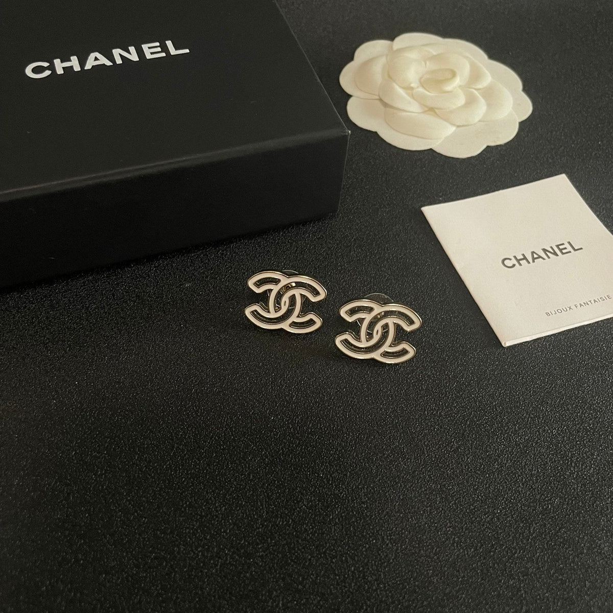 Martin Graham stud earrings in polished metal-tone – styled product view