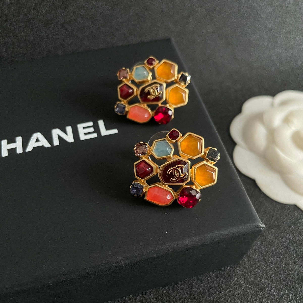 Martin Graham stud earrings in polished metal-tone – detail view